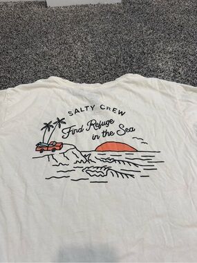 Salty Crew White Tee with Black Line Art and Coral Sunset